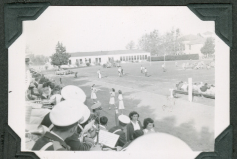 Band members and cheerleaders on side of field (ddr-densho-475-718)