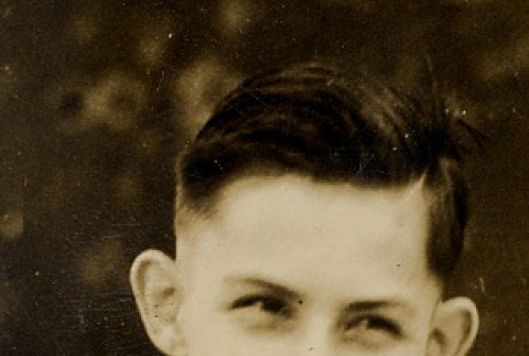 A boy smiling in a suit (ddr-njpa-1-266)