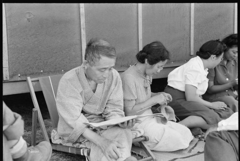 Japanese Americans relaxing in shade (ddr-densho-151-396)