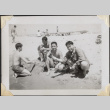 Four men sitting on beach (ddr-densho-466-861)