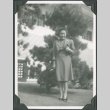 A woman standing in front of a tree (ddr-densho-300-191)