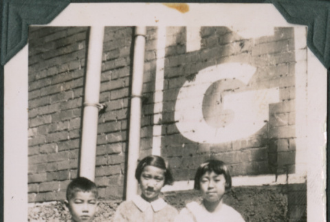 Five children next to brick building (ddr-densho-483-651)