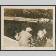 Man by pond (ddr-densho-316-215)