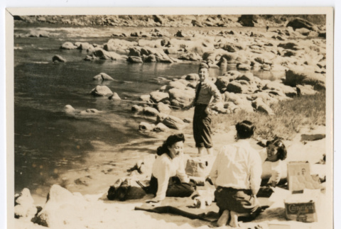 Mitsuye Takemiya and Charles Roeslin Jr. with others at beach (ddr-densho-550-38)