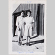 Two women standing outside barracks (ddr-densho-464-63)