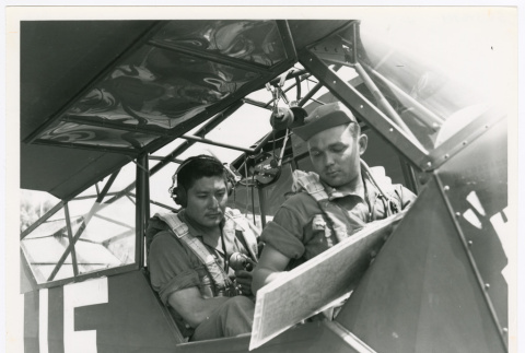 Staff Sergeant Arata Kimura, 522nd Field Artillery Battalion, and Cub Pilot Lieutenant Joseph C. Polancii in plane (ddr-densho-1007-144)