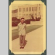 A man standing in front of a building (ddr-densho-328-201)