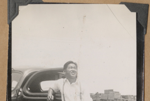 Mits poses with a car (ddr-densho-542-54)