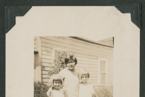 three girls outside a house (ddr-densho-378-510)