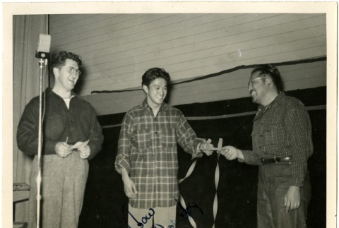 Three men at an auction (ddr-manz-6-15)