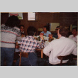 Group of people around a table with presents (ddr-densho-426-1287)
