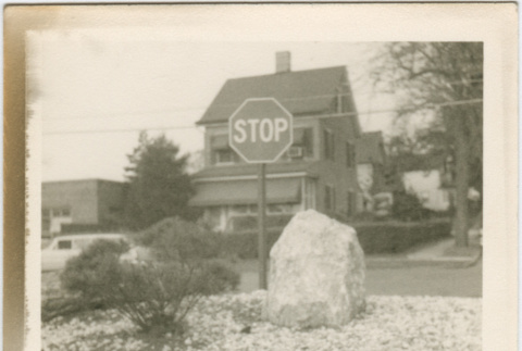 Landscaped traffic circle with stop sign at the Neptune Storage project (ddr-densho-377-110)