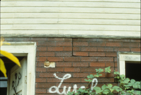 Graffitti on the Kubota family home in the lower Garden (ddr-densho-354-2659)