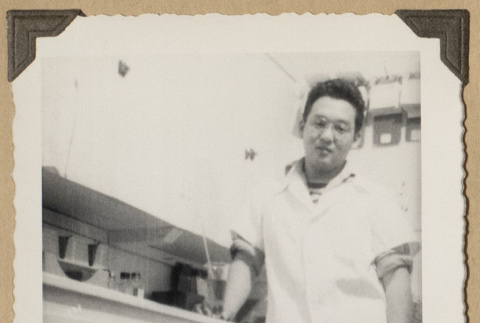Wolf Koyama at pharmacy counter (ddr-densho-542-502)