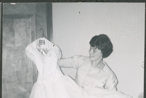 Bride holding wedding dress (ddr-densho-523-346)