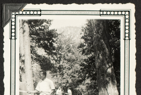 Mr. Shingue with a garden hose (ddr-densho-542-390)
