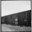 Woman and children outside barracks (ddr-densho-151-73)