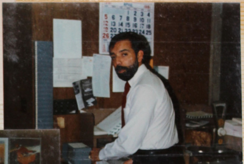 Man with beard standing by desk (ddr-densho-426-1347)