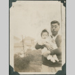 Gentaro Takahashi holding baby (ddr-densho-355-341)