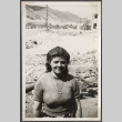 Woman standing with rubble in background (ddr-densho-466-103)
