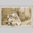 Family in front of a house (ddr-densho-321-664)