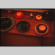 Display of lacquerware ashtrays and lighters (ddr-densho-426-321)