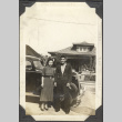 Man and woman standing by car (ddr-densho-326-503)