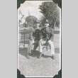 Two men sitting on park bench (ddr-ajah-2-601)