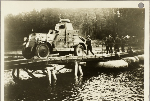 Soviet soldiers following a tank over a bridge (ddr-njpa-13-445)