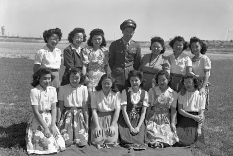 Ben Kuroki with a group of women at Minidoka (ddr-fom-1-355)