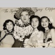 A man wearing leis, posing with three women (ddr-njpa-1-519)