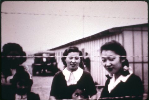 Two behind barbed wire (ddr-densho-1007-663)