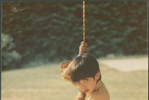 Boy on swing (ddr-densho-523-549)