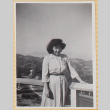 Woman standing by railing above roadway (ddr-densho-522-20)