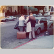 Men loading trunk of car (ddr-densho-426-1228)
