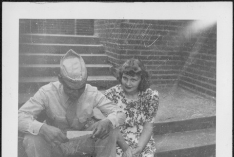 Man and woman sitting on steps (ddr-densho-434-492)