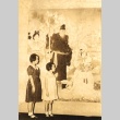 Hiroshi Saito's daughters looking at a Japanese painting (ddr-njpa-4-2538)