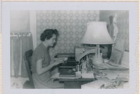 Betty using typewriter (ddr-densho-462-213)