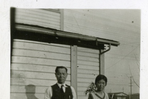 Issei couple in front of house (ddr-densho-182-61)