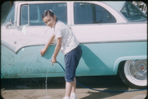 A girl washing a car (ddr-densho-338-483)