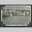 Men relaxing around pier (ddr-densho-540-95)