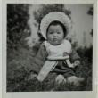 Baby in a dress and bonnet (ddr-densho-252-73)