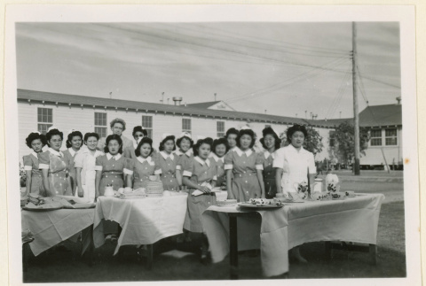 Dietitian aids at a hospital tea party (ddr-densho-37-1250)