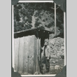 Man standing by shed (ddr-ajah-2-320)