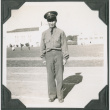 Man in uniform standing with buildings in background (ddr-ajah-2-145)