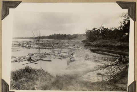 Man on the banks of the Mississippi River (ddr-densho-542-473)