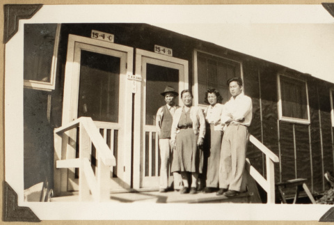 The Kikawas in front of their barrack (ddr-densho-542-406)