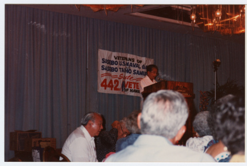 Man speaking at podium (ddr-densho-368-378)