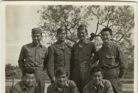Seven Japanese American soldiers posed outside (ddr-densho-201-86)