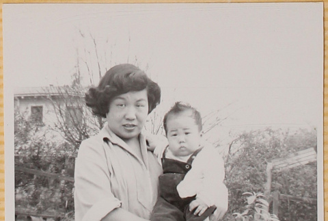 Yoshiko Shiomi holding Susan Shiomi (ddr-densho-522-165)